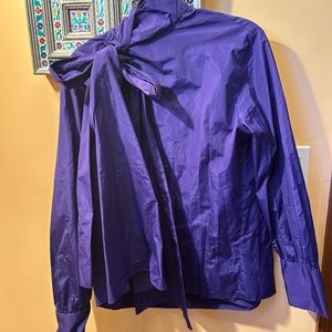 Deep, purple, blouse with a large bow that can be worn in various styles by Zara